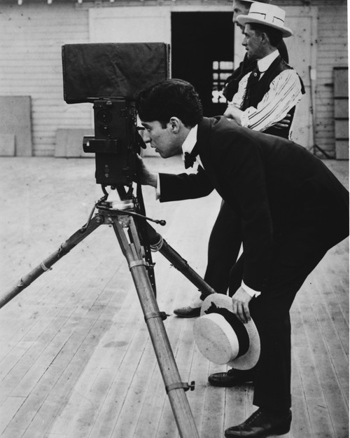 A photographer taking a photograph Photo Print - Item # VARCEL688023