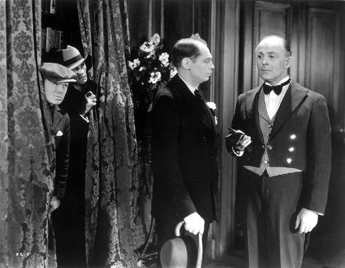 Film still featuring men in suits Photo Print - Item # VARCEL688061