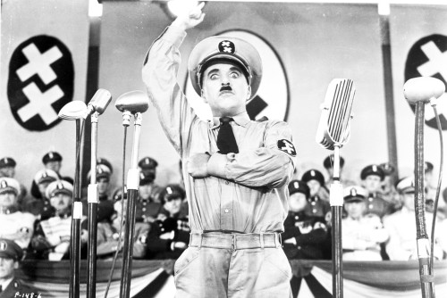 A film still of Charlie Chaplin standing in Nazi Uniform Photo Print - Item # VARCEL688129