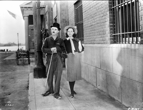 A film still of Charlie Chaplin walking with a co star Photo Print - Item # VARCEL688149