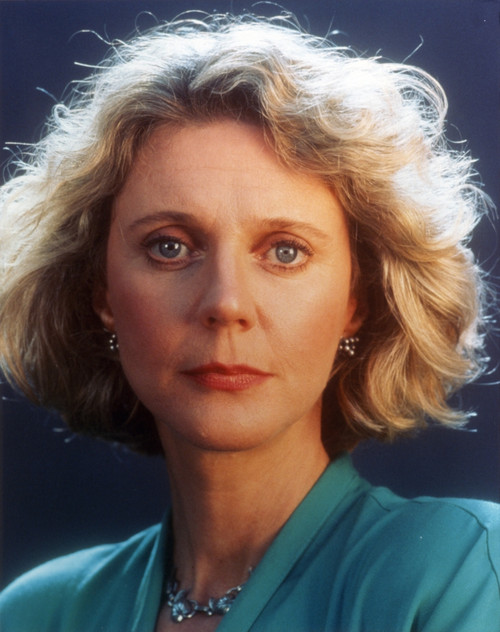 Blythe Danner wearing Blue Dress with Blue Background Close Up Portrait Photo Print - Item # VARCEL688218