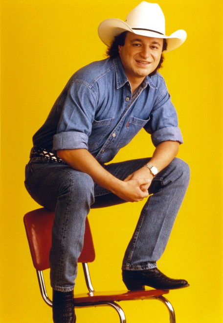 Mark Chesnutt sitting on Chair, wearing Cowboy Outfit with Black Leather Shoes Photo Print - Item # VARCEL688242