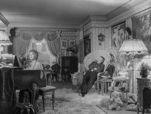Citizen Kane Man sitting on Couch, wearing Black Suit while Staring to Woman Photo Print - Item # VARCEL688393