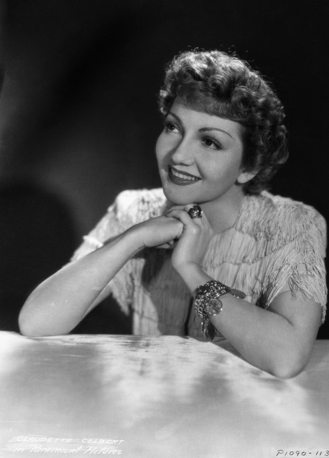 Claudette Colbert Leaning on Table with Black Background Photo Print - Item # VARCEL688518