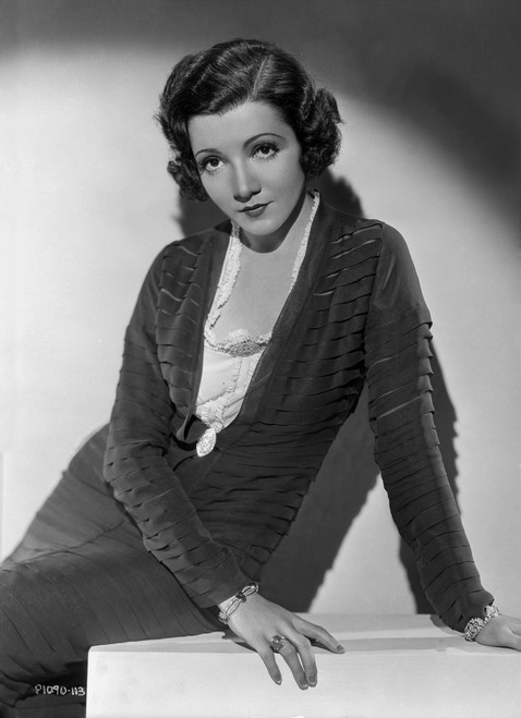 Claudette Colbert sitting in Black Dress Photo Print - Item # VARCEL688527