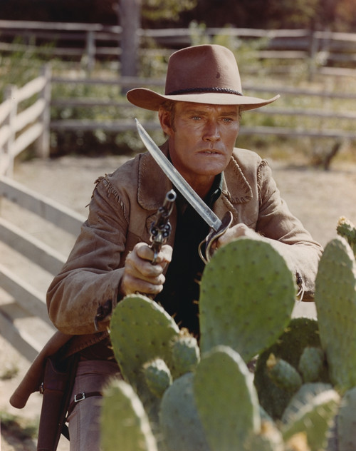 Chuck Connors Holding Weapon in Brown Coat Photo Print - Item # VARCEL688624