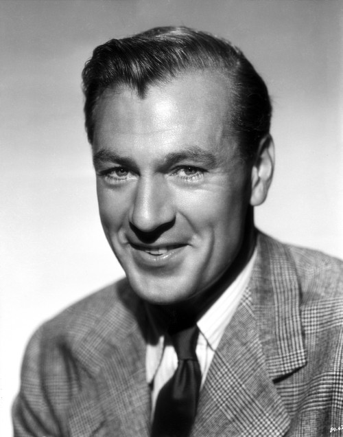 Gary Cooper smiling in Suit with Gray Background Photo Print - Item # VARCEL688673