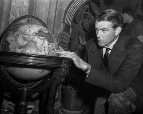 Gary Cooper Looking at Globe Photo Print - Item # VARCEL688674