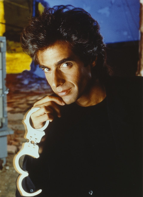 David Copperfield Holding Handcuffs in Black Shirt Photo Print - Item # VARCEL688682
