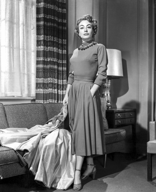 Joan Crawford beside a sofa Photo Print - Item # VARCEL688739