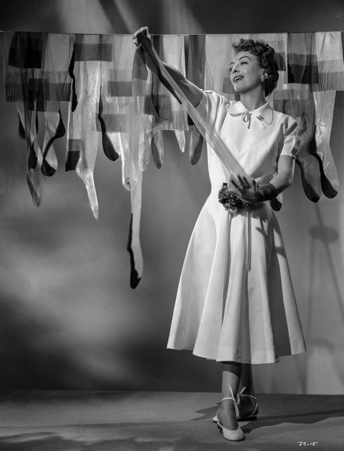 Joan Crawford Hanging Her Stockings in a Classic Portrait Photo Print - Item # VARCEL688759