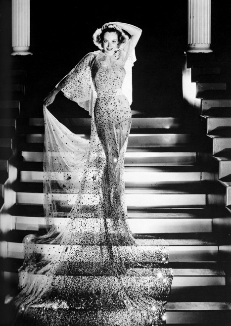 Joan Crawford wearing a sheer dress on a staircase Photo Print - Item # VARCEL688777