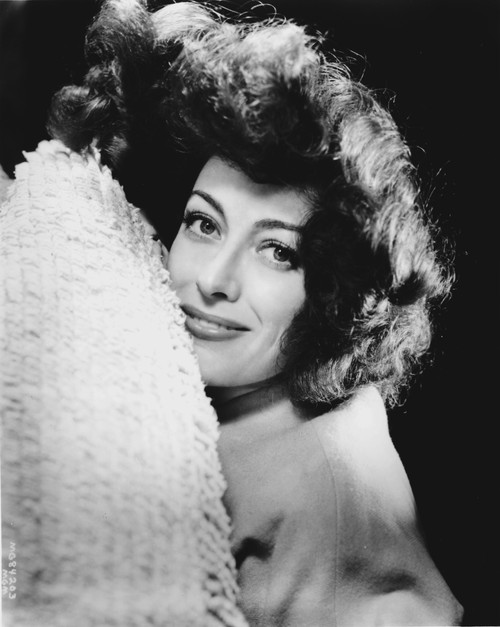Joan Crawford lying on a bed Photo Print - Item # VARCEL688790