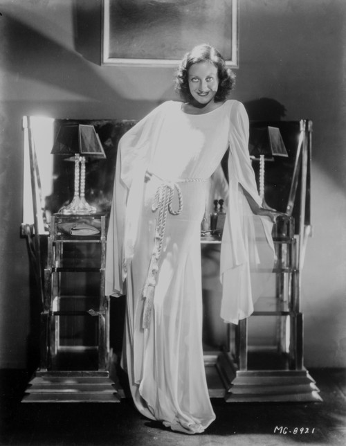 Joan Crawford leaning on a desk Photo Print - Item # VARCEL688788