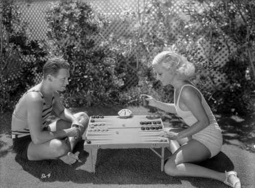 Joan Crawford Playing with a Guy in the Table Photo Print - Item # VARCEL688801