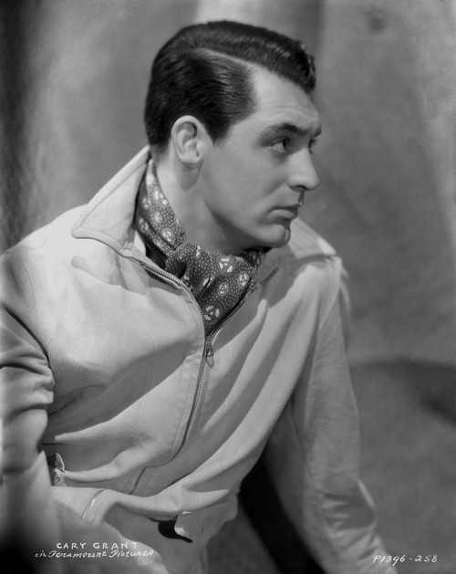Cary Grant in a coat and scarf with a part in his hair Photo Print - Item # VARCEL696054