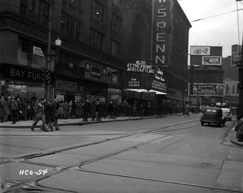 A crowd waiting outside of a movie theatre Photo Print - Item # VARCEL696118
