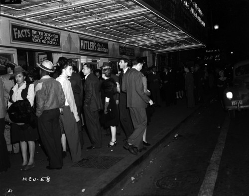 A crowd waiting outside of a movie theatre Photo Print - Item # VARCEL696130