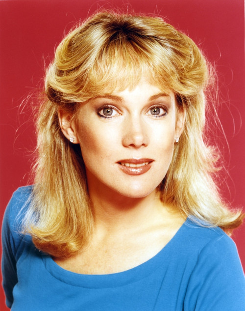 Julia Duffy wearing a Blue Tunic and Earrings in a Close Up Portrait Photo Print - Item # VARCEL696250