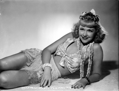 Joyce Compton Lying on the Ground and wearing a Two Piece in a Classic Portrait Photo Print - Item # VARCEL696295