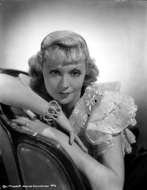 Joyce Compton Leaning on a Chair wearing a Dress in a Classic Portrait Photo Print - Item # VARCEL696323