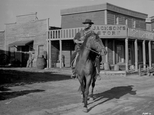 Clint Eastwood Ridding Horse in Cowboy Outfit Photo Print - Item # VARCEL696568
