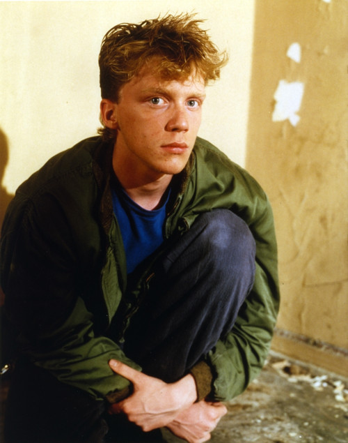 Anthony Hall sitting in Green Jacket Photo Print - Item # VARCEL696601