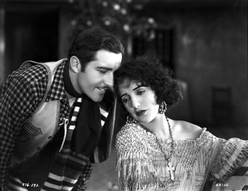 Bebe Daniels Leaning Back Her Head on the Man's Shoulder in Knitted Dress Photo Print - Item # VARCEL696634
