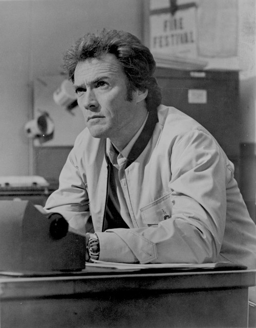 Clint Eastwood sitting in White Jacket Portrait Photo Print - Item # VARCEL696643