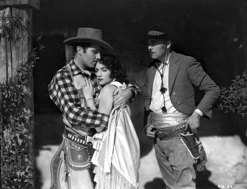 Bebe Daniels hugging the Man in Polka Dot Long Sleeve Shirt while Touching His Chest Photo Print - Item # VARCEL696657
