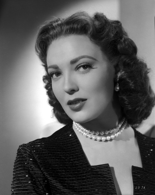 Linda Darnell posed wearing Pearl Necklace in Black and White Photo Print - Item # VARCEL696780