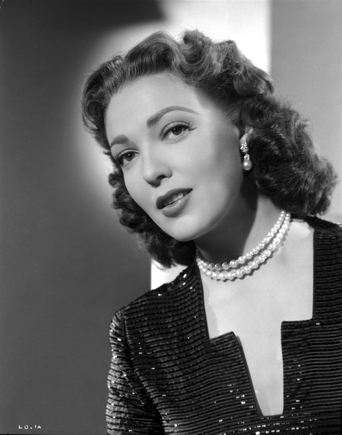 Linda Darnell posed wearing Pearl Necklace in Black and White Photo Print - Item # VARCEL696784