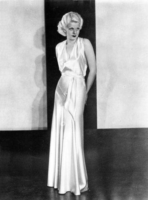 Jean Harlow Posed in White Silk Long Dress and High Waist Flared Skit with Hands on the Back Photo Print - Item # VARCEL696817