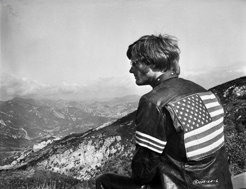 Easy Rider Seated in American Flag Jacket Photo Print - Item # VARCEL696811