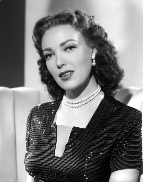 Linda Darnell posed wearing Pearl Necklace in Black and White Photo Print - Item # VARCEL696844