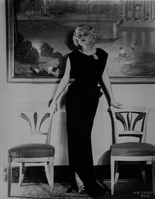 Jean Harlow Posed in Black Frilled Waist Sleeveless Velvet Dress Photo Print - Item # VARCEL696961