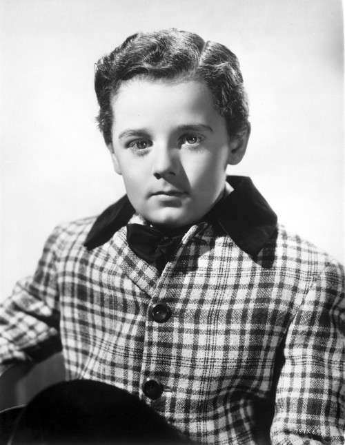 Freddie Bartholomew sitting on Side Boat in White Suit Photo Print - Item # VARCEL697034