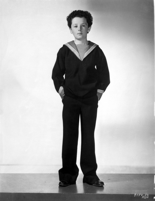 Freddie Bartholomew Leaning on Chair White Graduation Cap Photo Print - Item # VARCEL697059