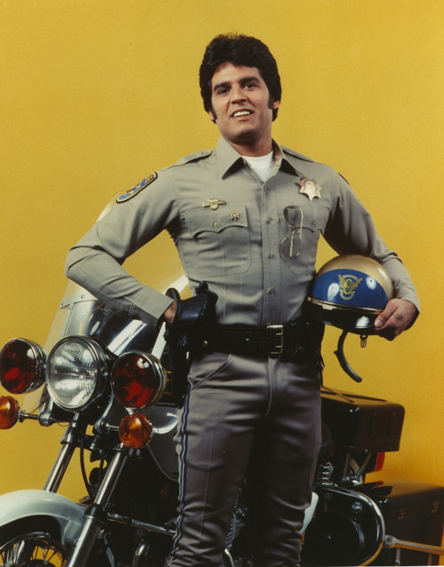 Erik Estrada Holding Helmet in Police Uniform Photo Print - Item # VARCEL697086