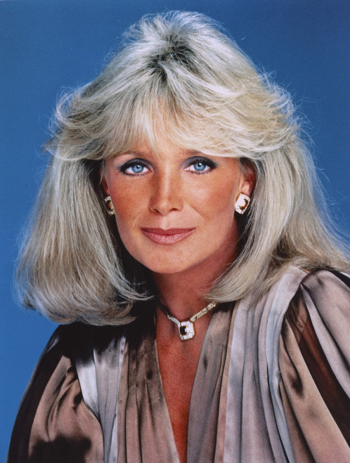 Linda Evans Blue Background Close Up Portrait Photo Print - Item # VARCEL697113