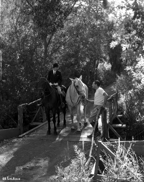 Richard Barthelmess riding a horse Photo Print - Item # VARCEL697122