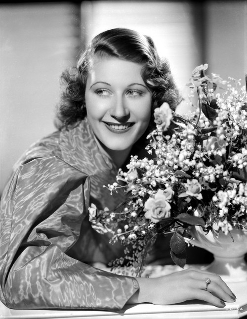 Joan Davis smiling in A Portrait While Holding A Bouquet of Flowers in Black and White Photo Print - Item # VARCEL697123