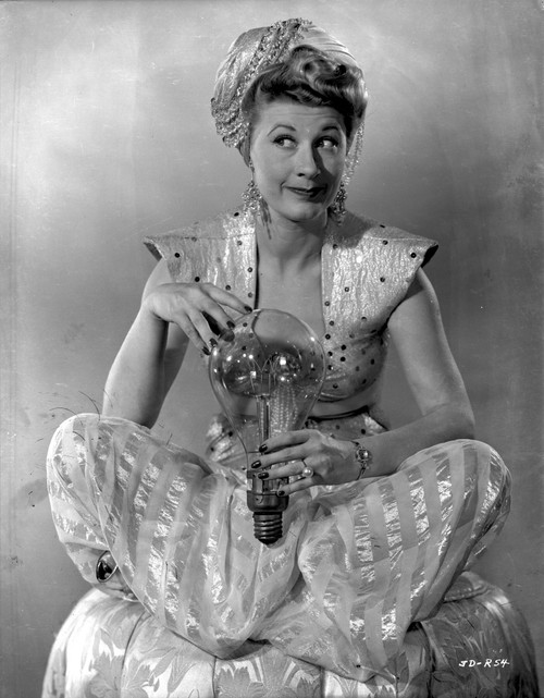 Joan Davis posed While Holding A Lightbulb in Black and White Photo Print - Item # VARCEL697148