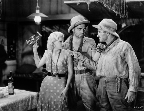 Jean Harlow Scene from a Film standing in White Scoop Neck Polka Dot Dress and Black Waist Belt with Long Necklace Photo Print - Item # VARCEL697193