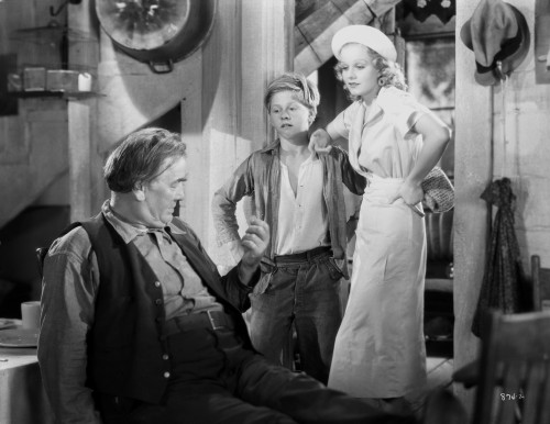 Jean Harlow Scene from a Film standing in White V-Neck Gathered Bodice Short Sleeve Dress with Straight Long Skirt Photo Print - Item # VARCEL697232