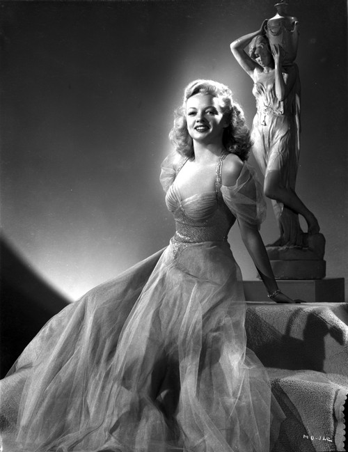 Myrna Dell Seated and smiling in Long Dress Photo Print - Item # VARCEL697405