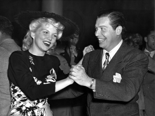 Milton Berle dancing with a woman Photo Print - Item # VARCEL697409