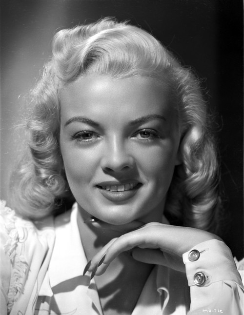 Myrna Dell smiling in A Portrait With Hands on Chin in Black and White Photo Print - Item # VARCEL697416