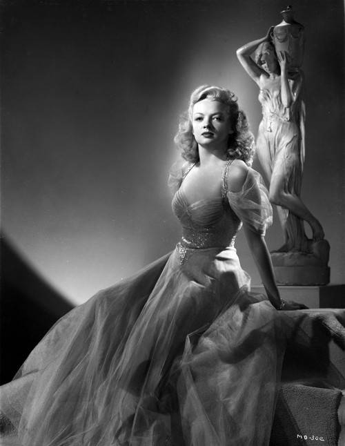 Myrna Dell Seated in Long Dress Photo Print - Item # VARCEL697428