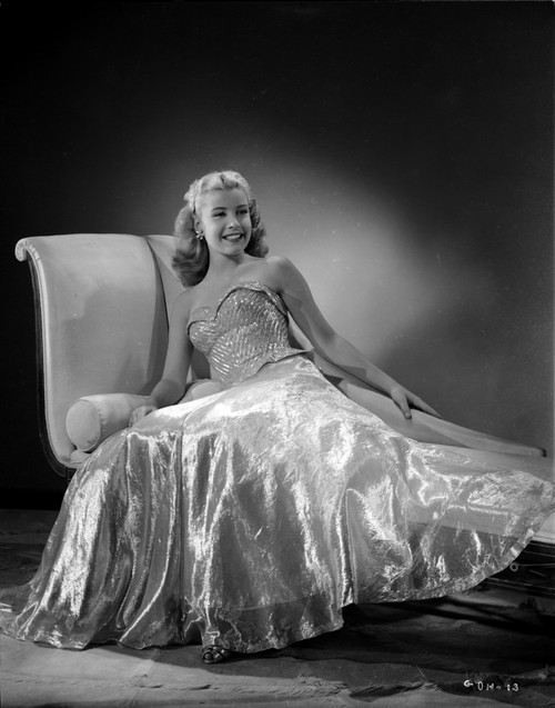 Gloria DeHaven Leaning On A Couch in Gown in Black and White Photo Print - Item # VARCEL697482